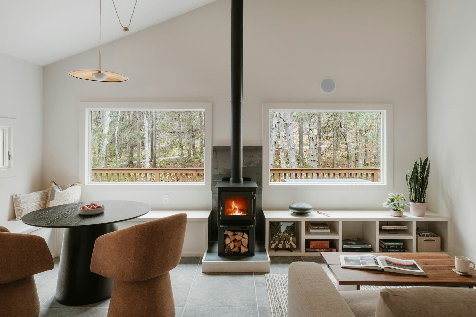 Cozy modern living room with fireplace and large windows